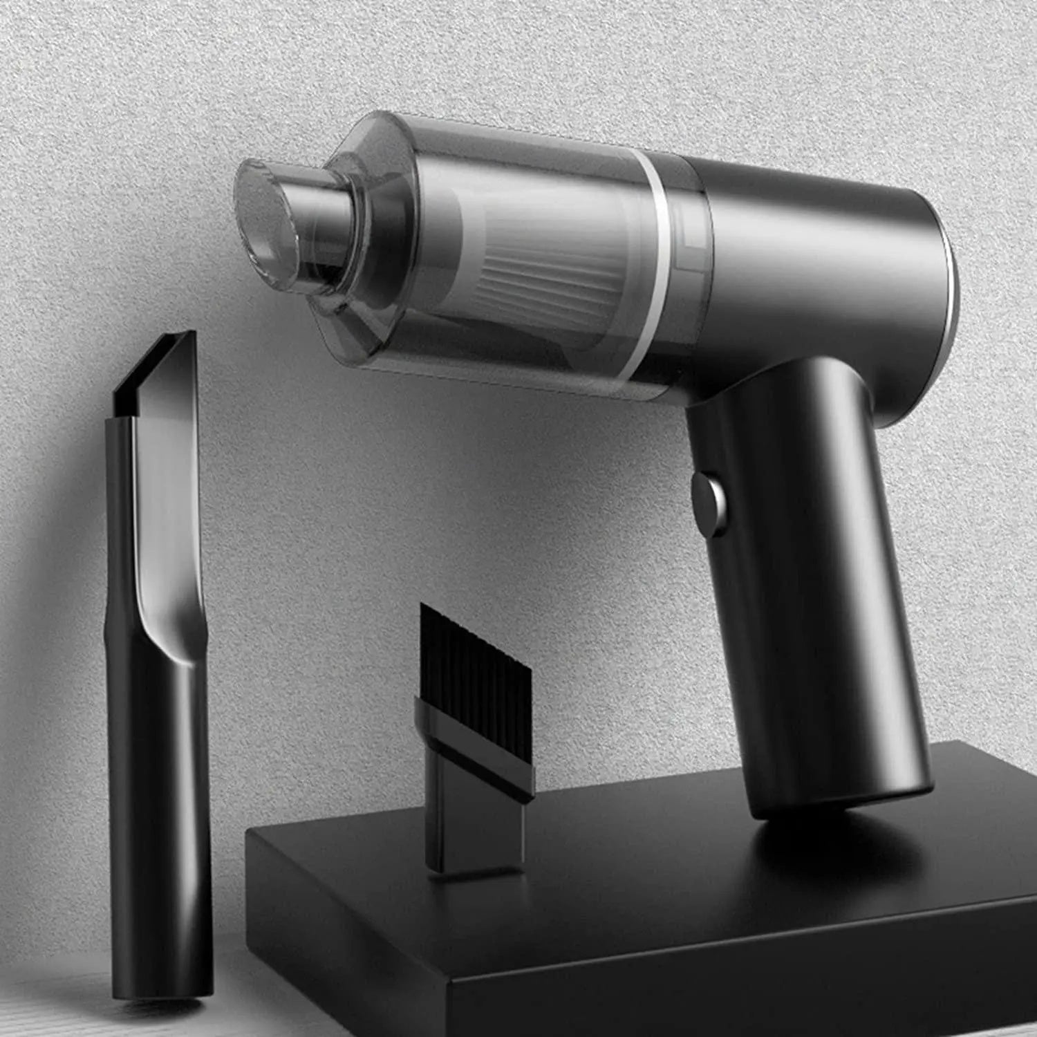 Handheld vacuum cleaner with attachments on a gray background