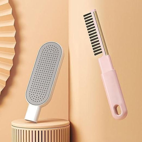 White paddle brush and pink comb on a beige background